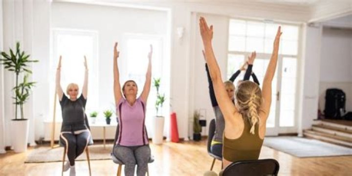 Chair Yoga Is the New All-Ages Fitness Trend That Can Make You Look and Feel Younger
